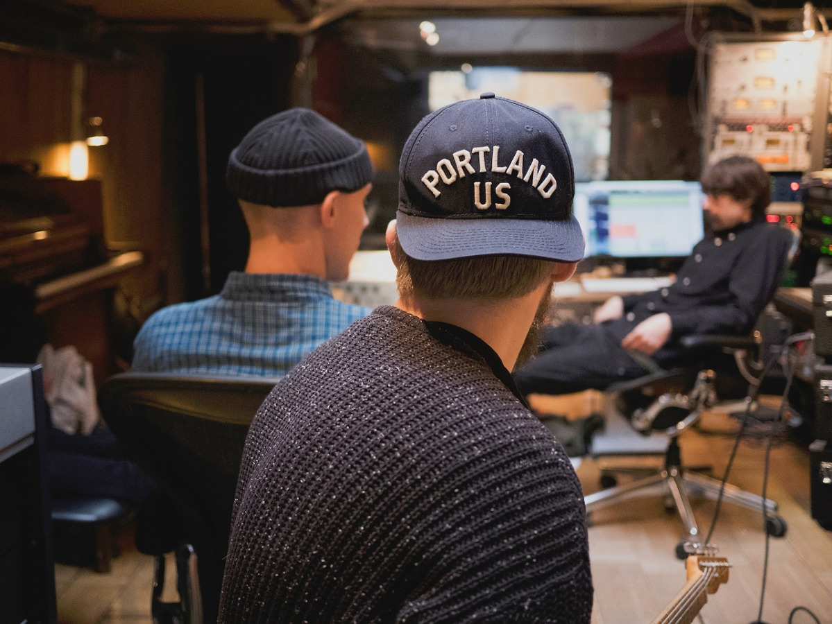 music producers collaborating in studio