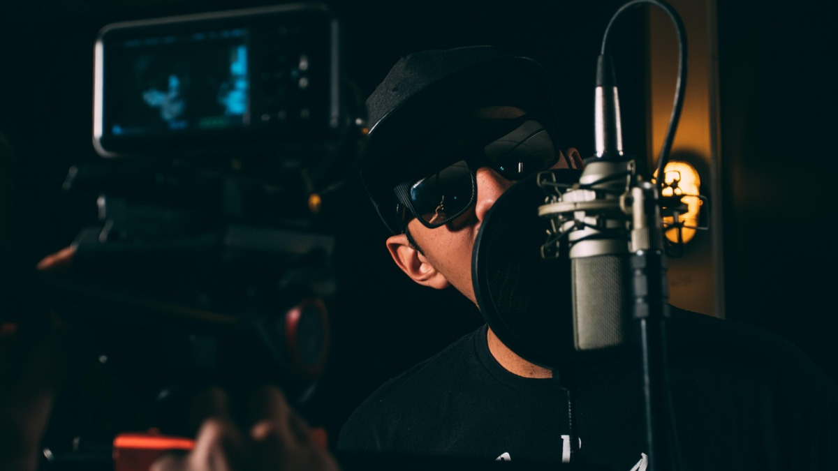recording session vocalist in studio booth